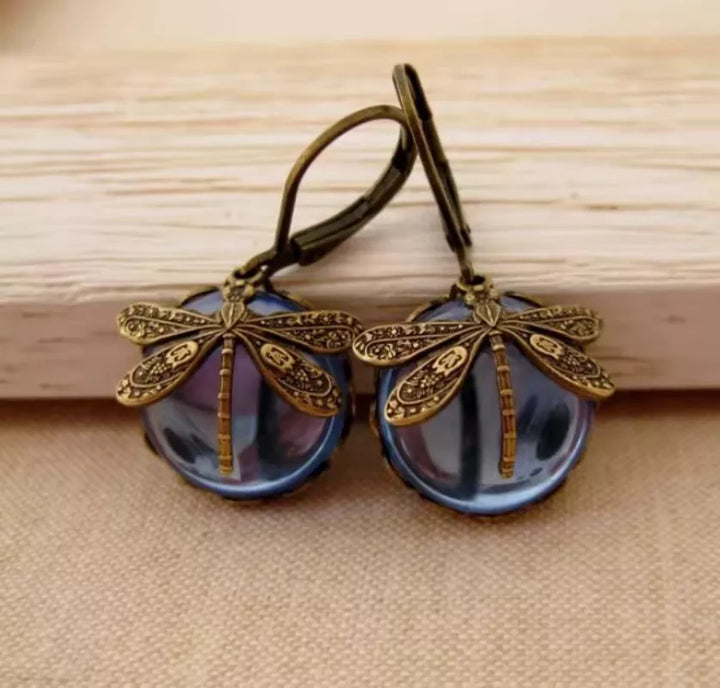 Nature-inspired women's elegant moonstone drop earrings with exquisite sterling silver dragonfly design.