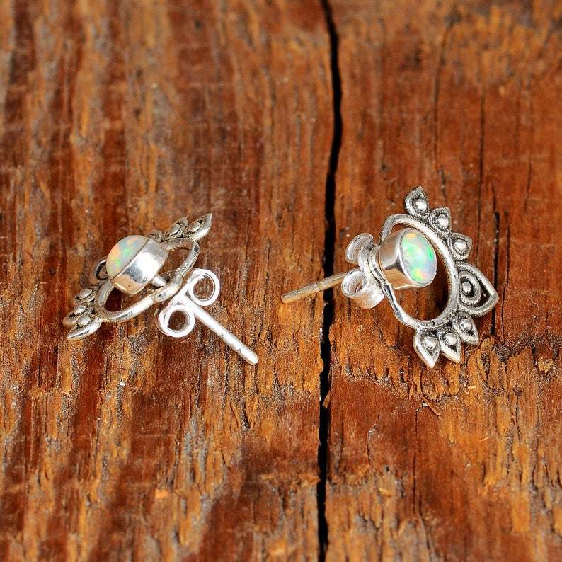 Stylish women's opal lotus earrings crafted from sterling silver, embodying elegance and natural beauty.