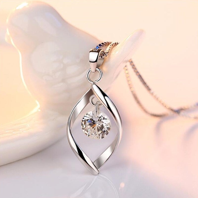 Dainty silver necklace for women featuring a radiant zirconia crystal pendant, timeless elegant jewelry for her.