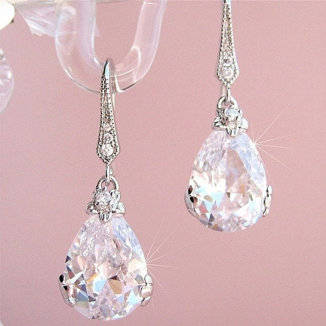 Elegant women's sterling silver pear drop earrings with sparkling crystals. Perfect for special occasions.