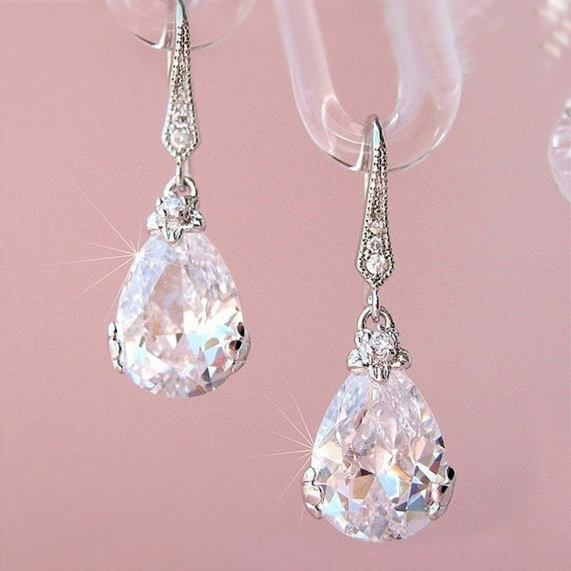 Sparkling rhinestone pear drop earrings in sterling silver, an elegant and classic design for women.