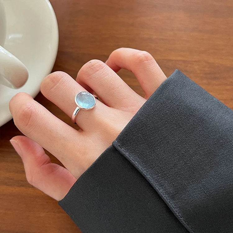 Stunning blue aquamarine gemstone ring in sterling silver for women, evoking ocean tranquility and elegance.