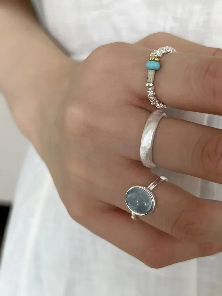 Beautiful women's sterling silver ring featuring a vibrant natural aquamarine crystal, an elegant gemstone jewelry.