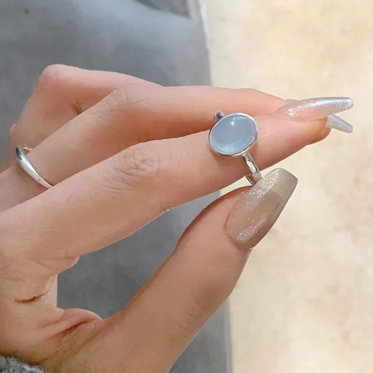 Close-up of elegant women's sterling silver ring, showcasing a sparkling natural aquamarine gemstone for style.
