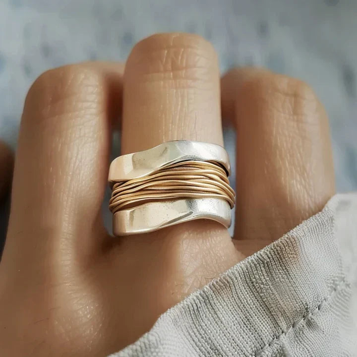 Elegant women's sterling silver ring with delicate gold accents, two-tone design, perfect for everyday wear or a gift.