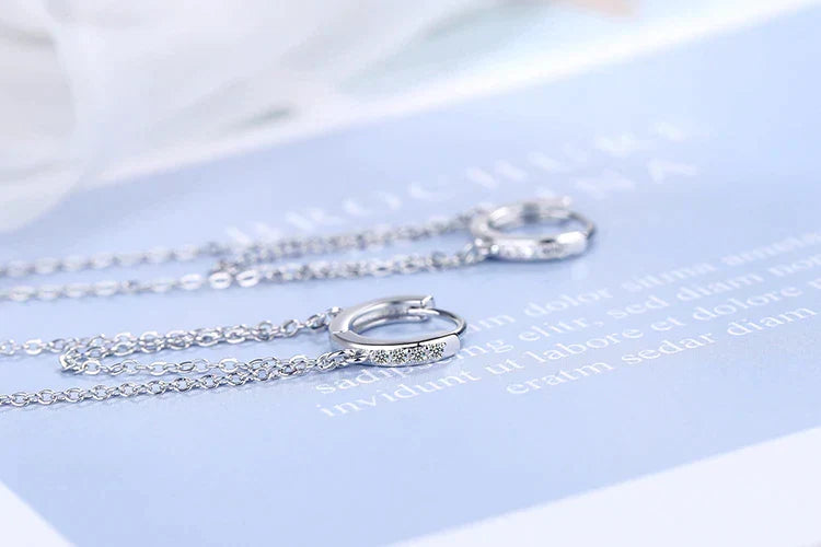 Sparkling sterling silver chain dangle earrings for women, featuring a delicate and elegant design.