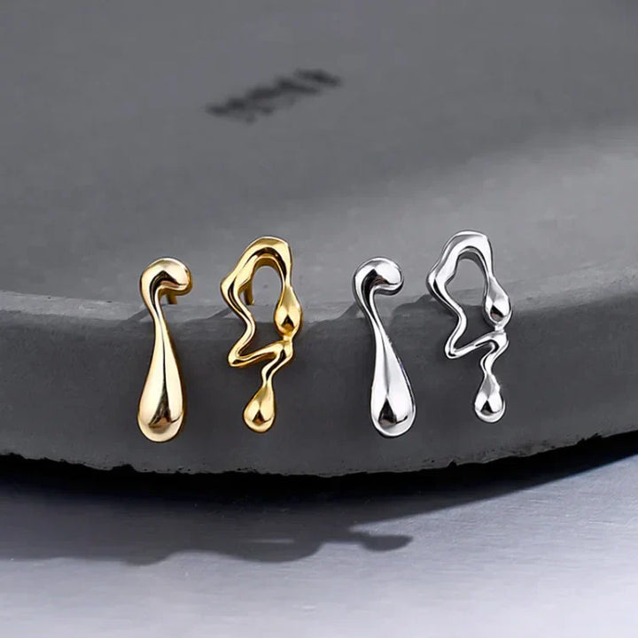 Elegant women's sterling silver water droplet earrings. Modern, hypoallergenic design, perfect fashion jewelry gift for her.