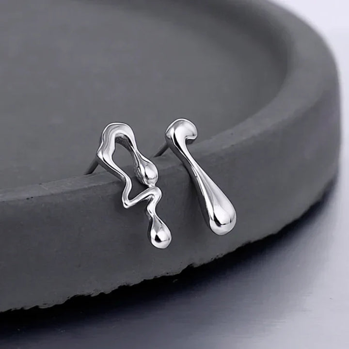Stylish water droplet earrings for women, featuring a modern and elegant sterling silver design. Hypoallergenic jewelry.
