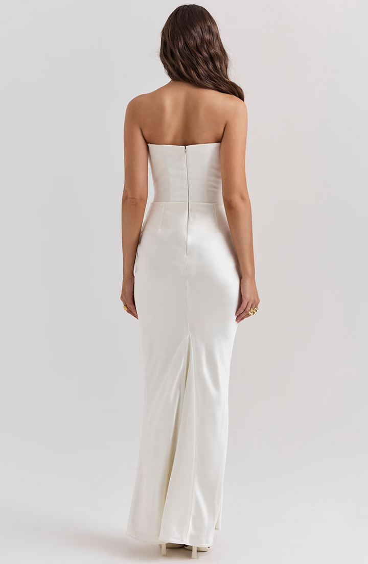 Glamorous strapless corset maxi dress for women, an eye-catching wedding guest dress or gala attire.