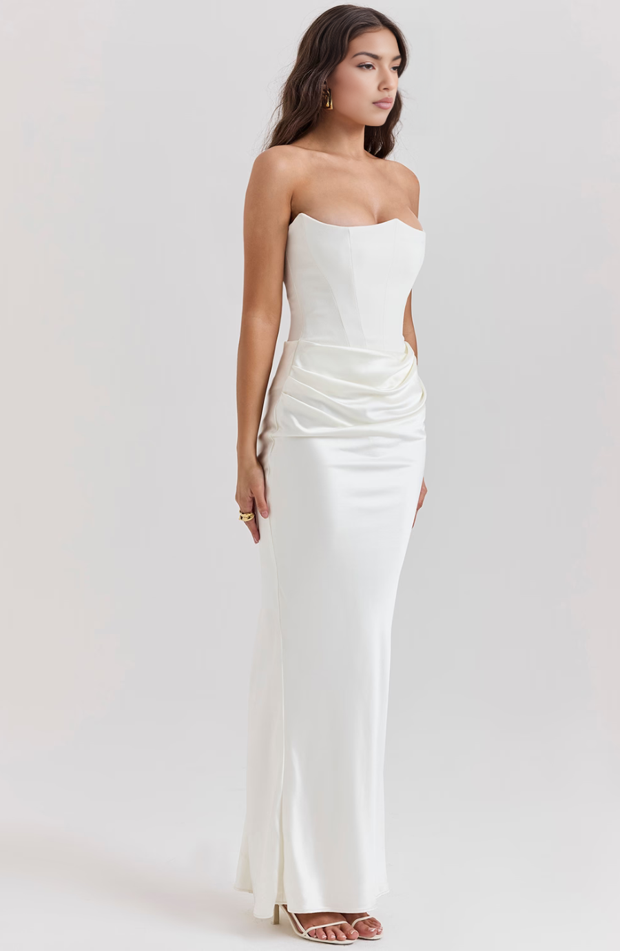 Graceful strapless corset maxi dress for women, ideal for a refined wedding guest or gala appearance.