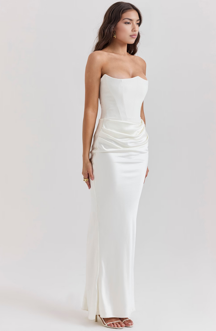 Graceful strapless corset maxi dress for women, ideal for a refined wedding guest or gala appearance.