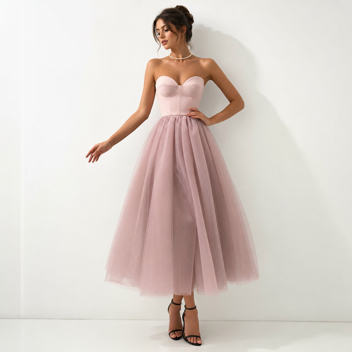 Romantic pink strapless formal dress for women, an elegant evening gown with a beautiful pleated skirt for special occasions.