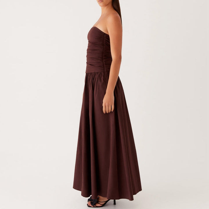 Modern strapless maxi dress, women's elegant floor-length style for summer evening parties.