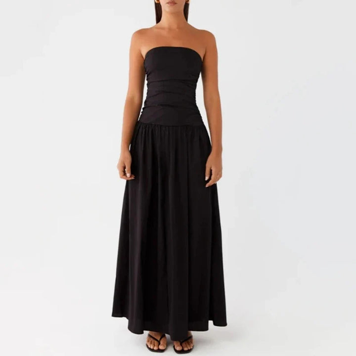 Versatile women's strapless maxi dress, elegant resort wear ideal for summer evenings.