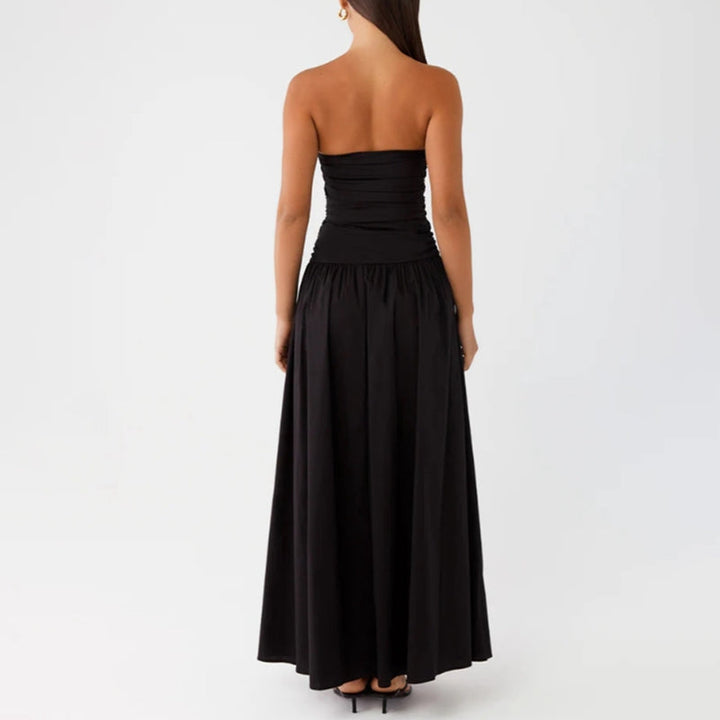 Full view of elegant women's strapless maxi dress, floor-length, perfect for summer evening wear.