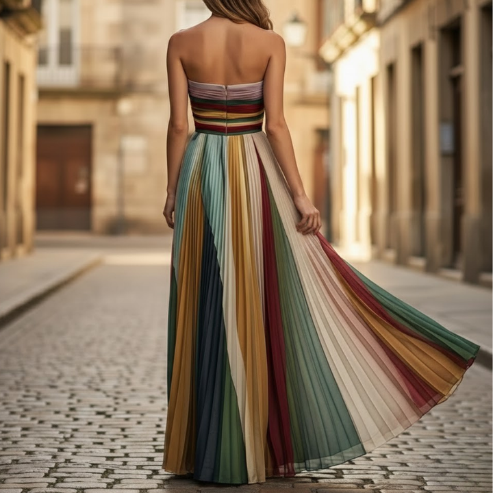 Flowing pleated midi dress for women, a stylish strapless summer outfit ideal for wedding guests or events.