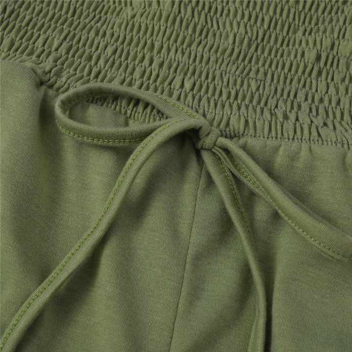 Modern women's wide-leg jumpsuit, strapless bandeau style for a chic & breezy summer vibe.