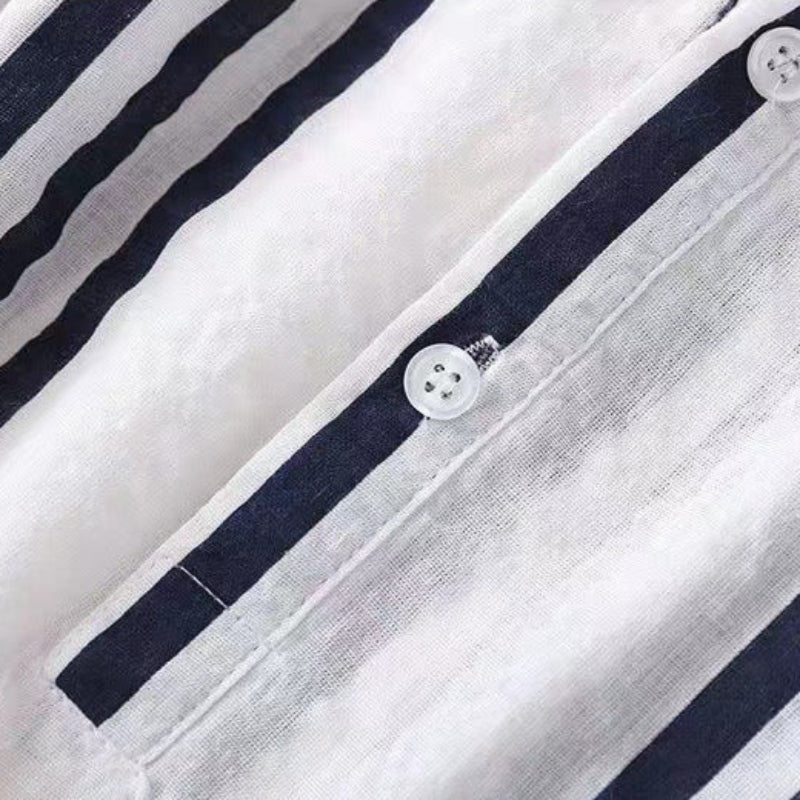 Stylish women's striped button-up blouse with elegant design, comfortable for office or classic casual wear.
