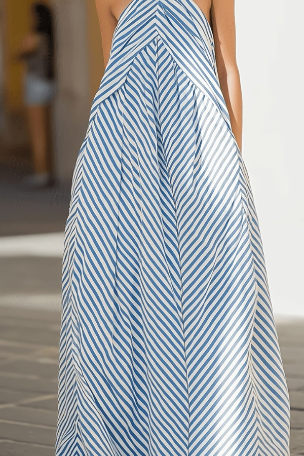 Beautiful women's striped halter dress, a flowy maxi design with elegant open back for vacation.