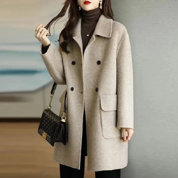 Elegant women's structured long coat, classic style for sophisticated fall and winter fashion outerwear.