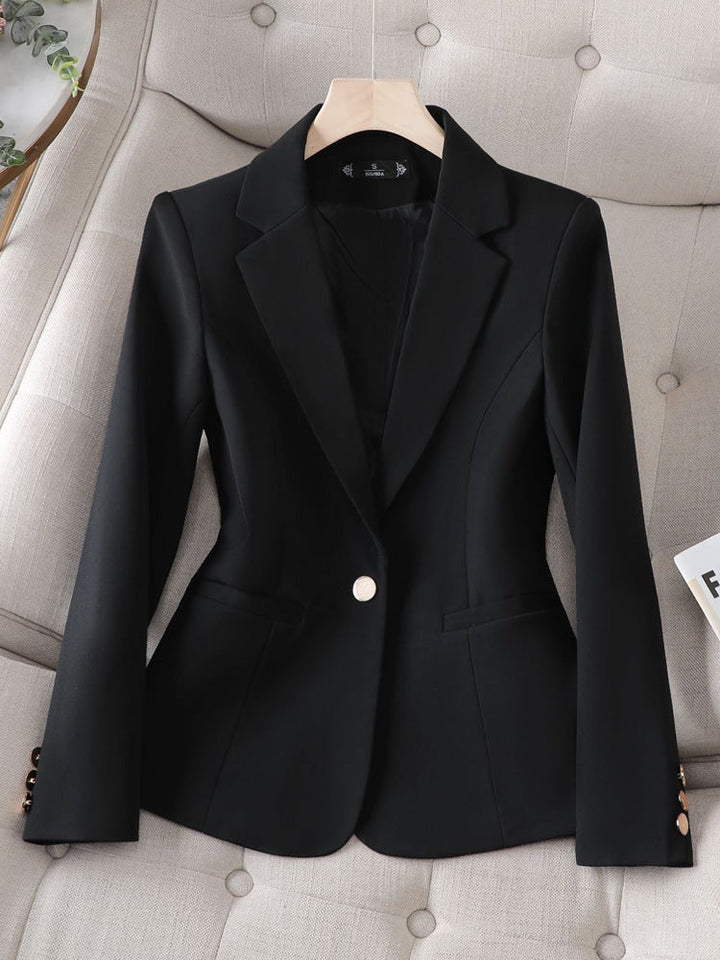 Chic women's structured blazer with single button. Ideal tailored jacket for elegant workwear or stylish casual fashion.