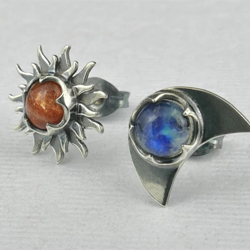 Stylish women's sun and moon celestial drop earrings. Unique symbolic jewelry accessory, perfect for everyday wear.