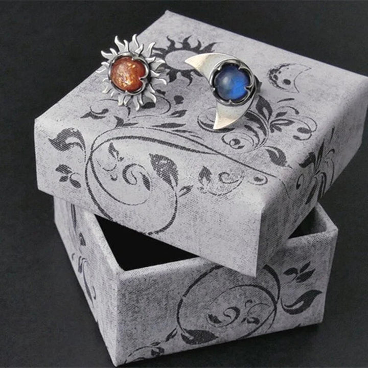 Women's sun and moon celestial drop earrings, elegant symbolic jewelry for a stylish accessory choice.