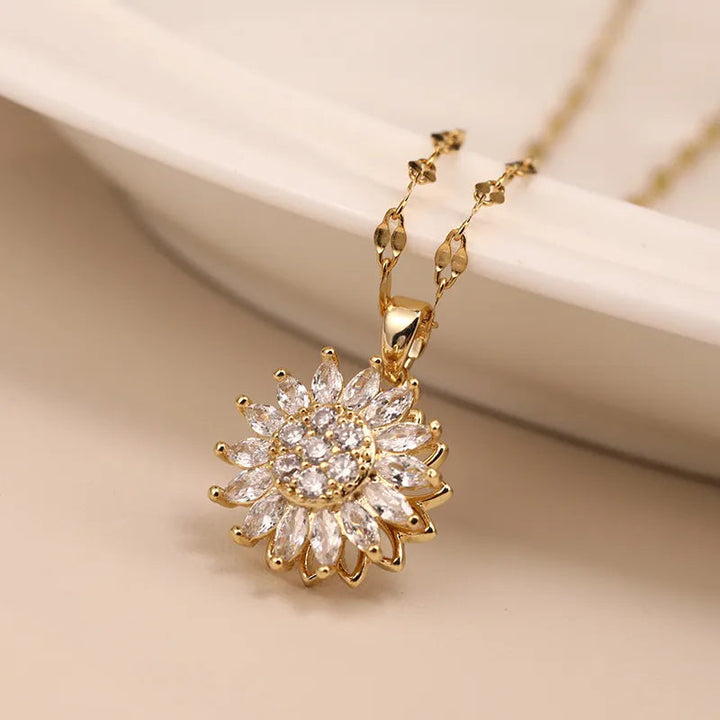 Stunning gold sunflower rotating pendant necklace for women, a unique spin duo design and adjustable chain, statement jewelry.
