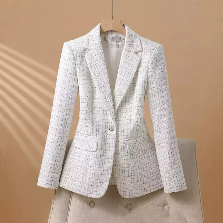 Chic pink women's tailored blazer, featuring elegant pearl buttons, ideal for professional or formal occasions.