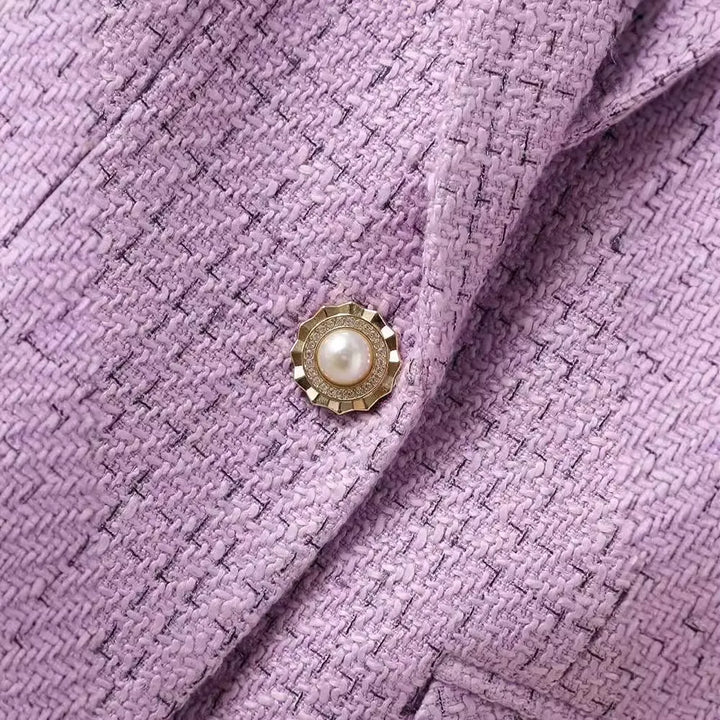 Women's elegant tailored blazer, enhanced with luxurious pearl buttons, a chic choice for formal attire.