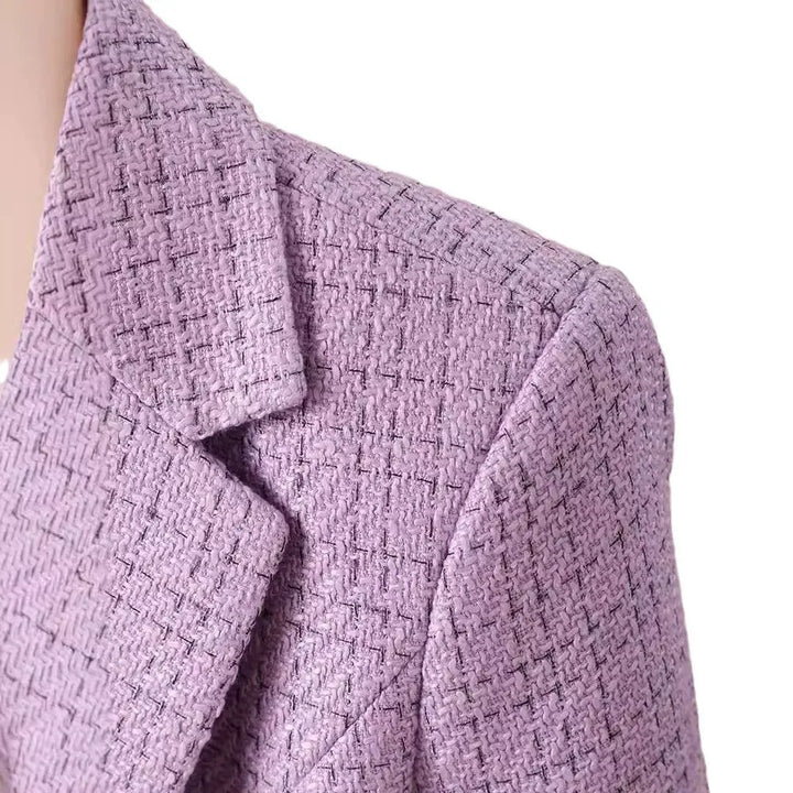 Professional women's tailored blazer with elegant pearl buttons, perfect for business attire & chic style.