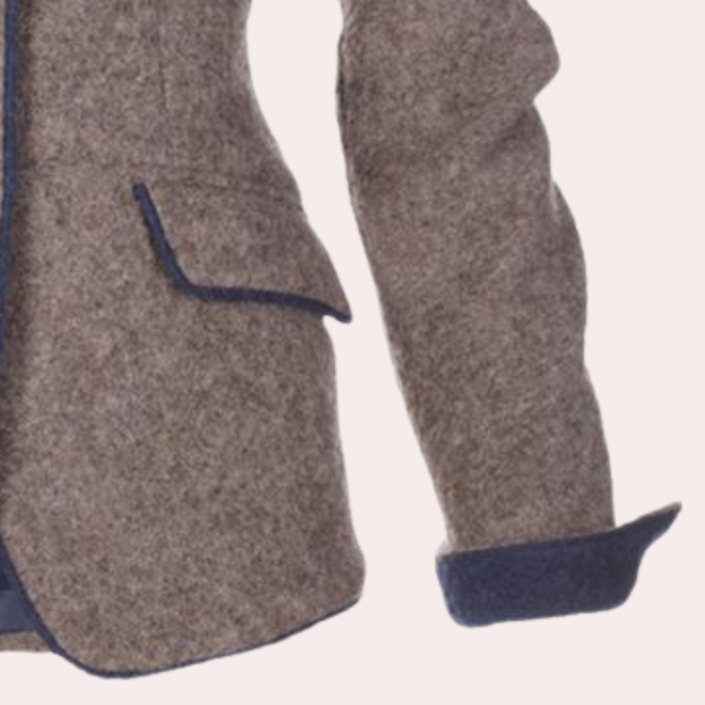 Stylish women's tailored brown blazer jacket, a chic outerwear piece for modern professional fashion.
