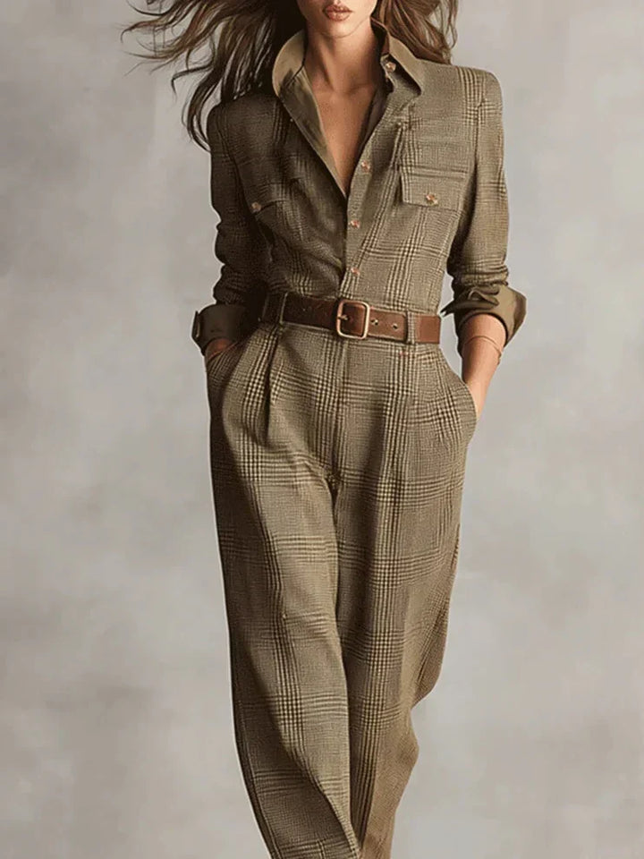 Versatile women's belted tailored jumpsuit in brown. Ideal elegant casual wear for modern professional or chic outing.