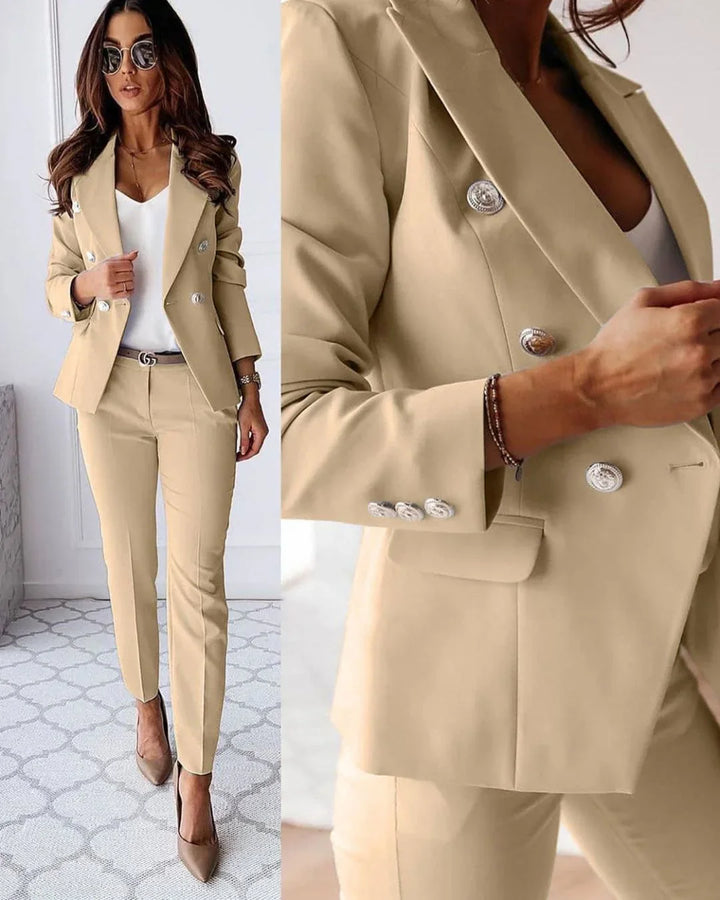 Chic tailored women's two-piece suit with double-breasted blazer & trousers, ideal for formal workwear.