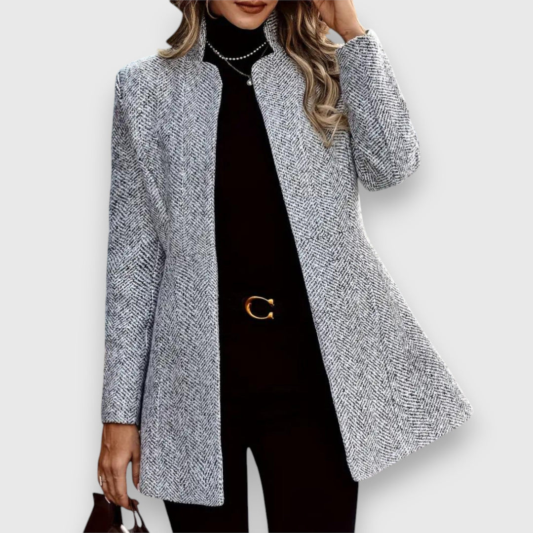 Elegant women's tailored gray blazer for professional wear. Chic business attire with a sophisticated cut.