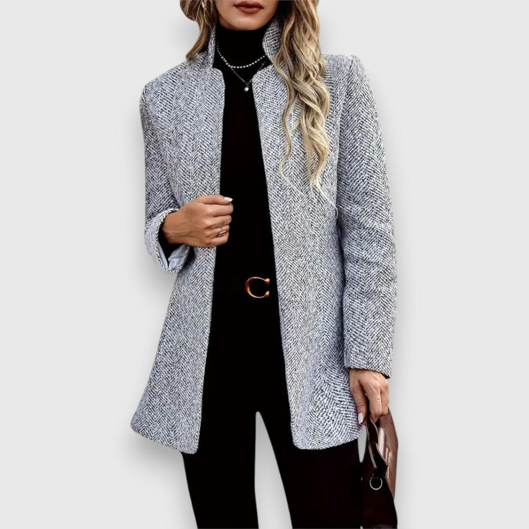 Stylish women's tailored gray blazer. Perfect professional jacket for elegant office and business wear.