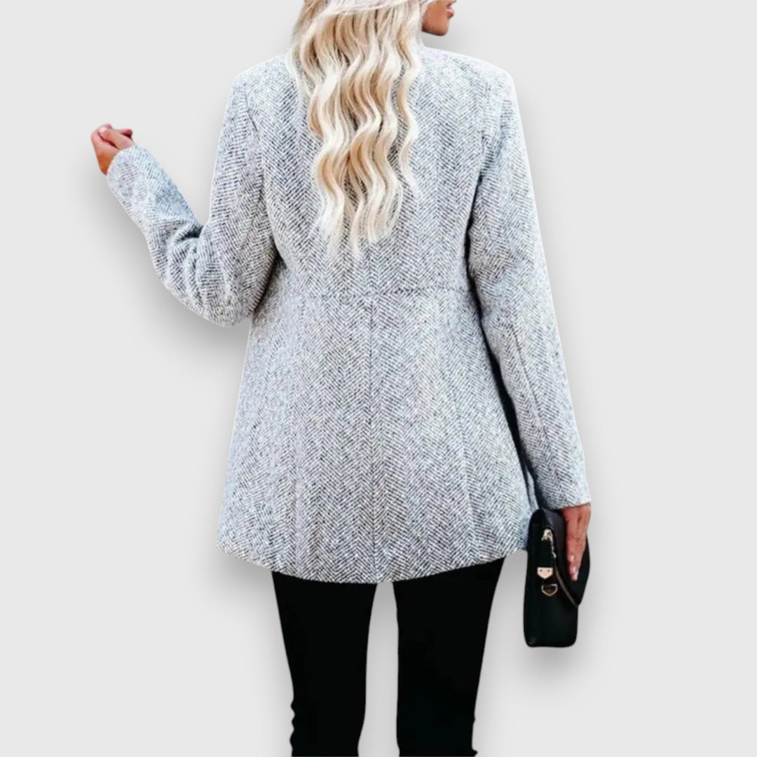 Front view of a chic women's gray blazer. A classic tailored jacket for professional & versatile fashion.