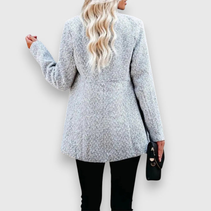 Front view of a chic women's gray blazer. A classic tailored jacket for professional & versatile fashion.