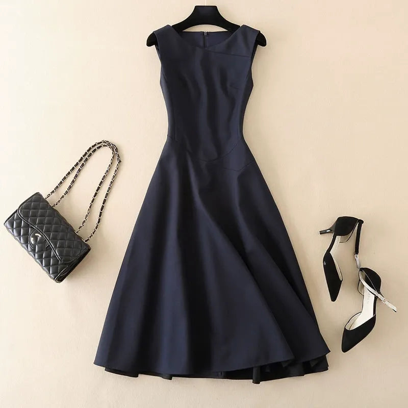 Elegant women's tailored sleeveless dress in navy, perfect for work or cocktail events. Sophisticated fashion.