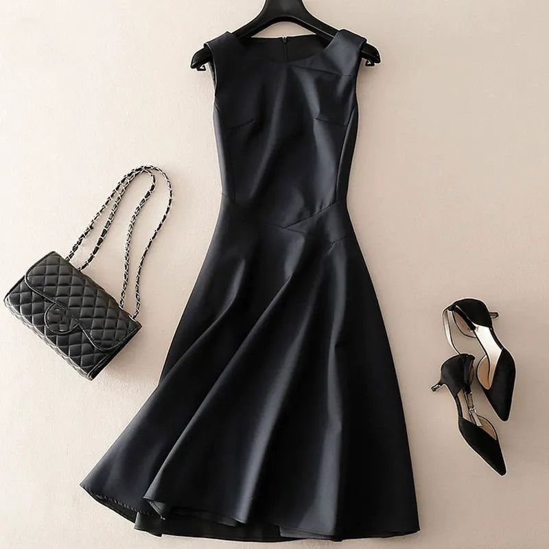 Versatile women's sleeveless tailored dress in black, ideal for office or sophisticated evening wear.