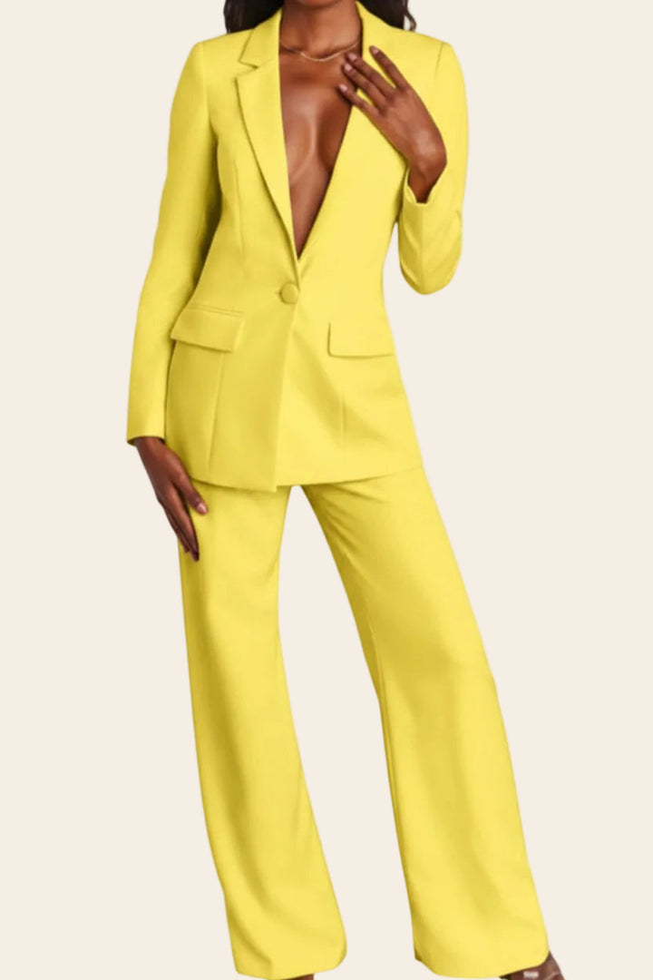 Structured blazer and slim trousers define this elegant women's tailored suit set. Business & formal.