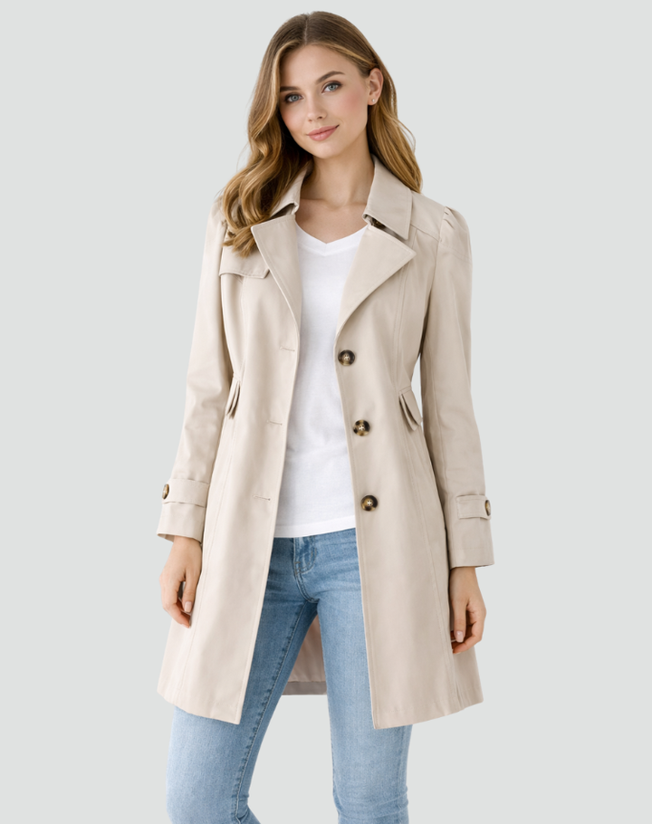 Stylish women's tailored trench coat. Classic button-up design offers versatile elegance for fall & spring outerwear.
