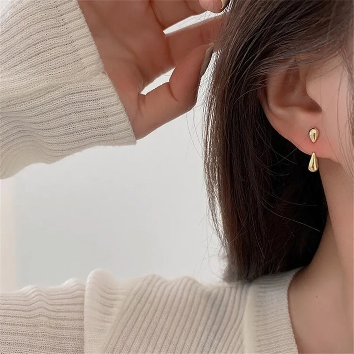 Elegant women's teardrop stud earrings, perfect for everyday wear & special occasions. Gold-plated sterling silver.