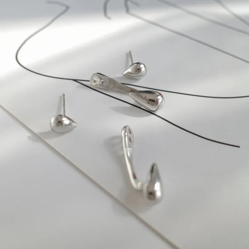 Delicate women's teardrop stud earrings. Elegant, gold-plated design for a subtle, classic everyday sparkle.