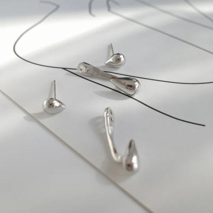 Delicate women's teardrop stud earrings. Elegant, gold-plated design for a subtle, classic everyday sparkle.