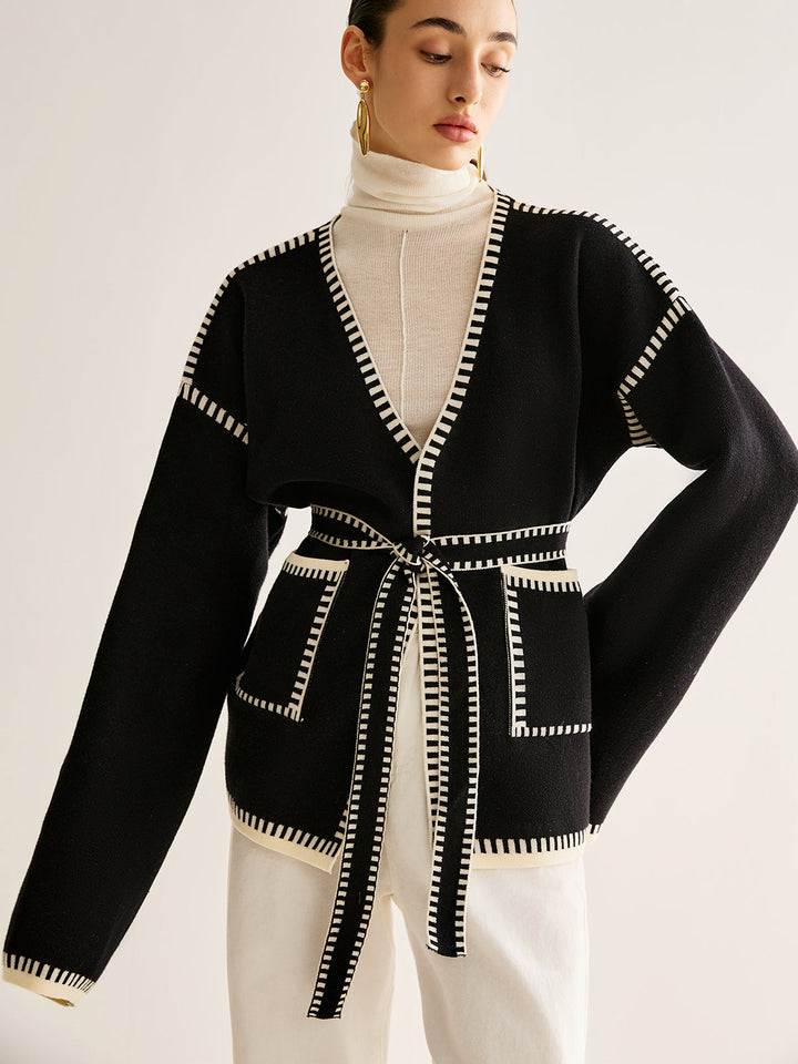 Elegant women's tied belted cardigan sweater, perfect for fall and winter layering. Cozy knit long sleeve top.