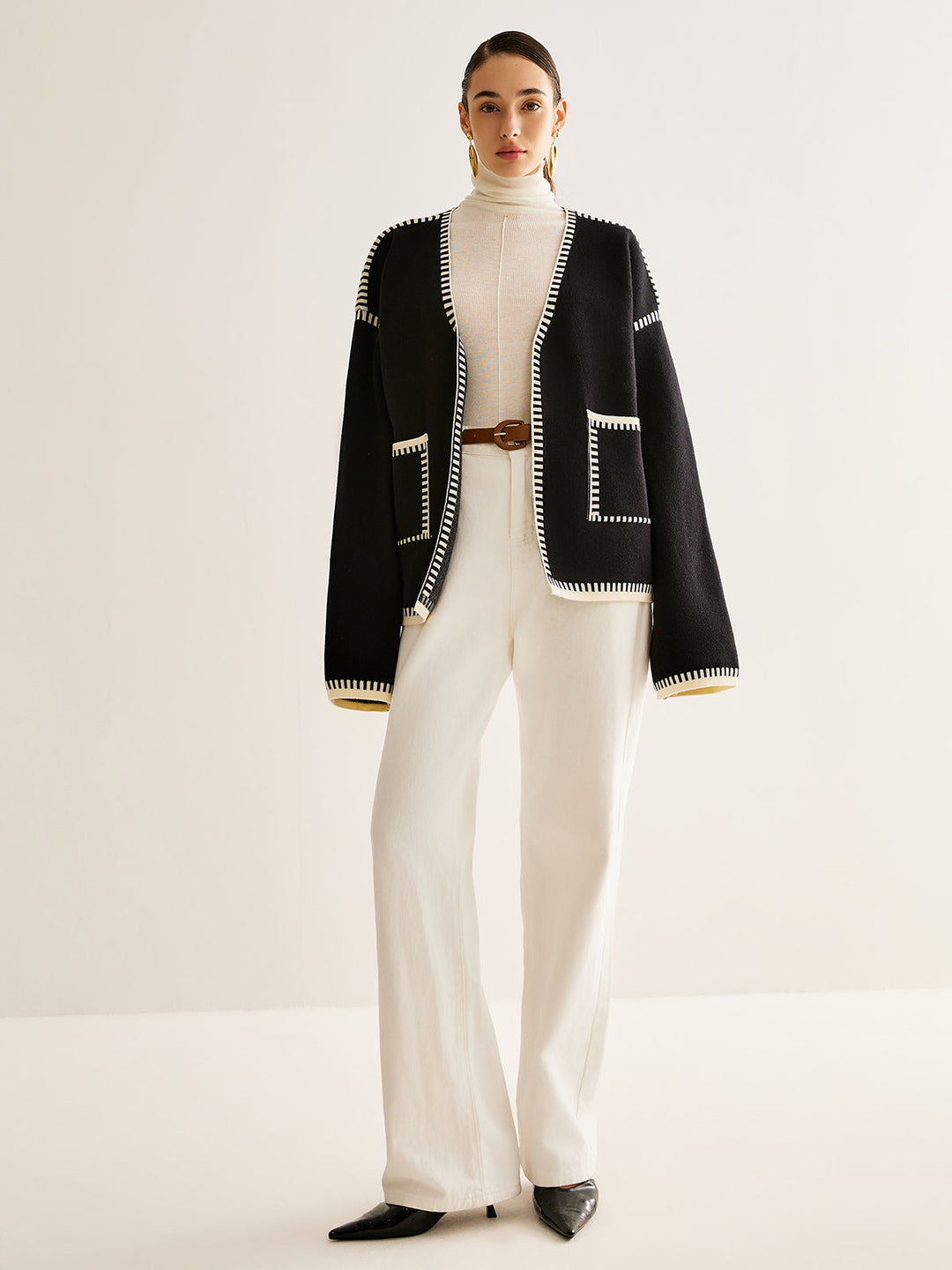 Cozy knit women's long sleeve cardigan sweater with a tied belt, ideal for casual wear and layering in fall.