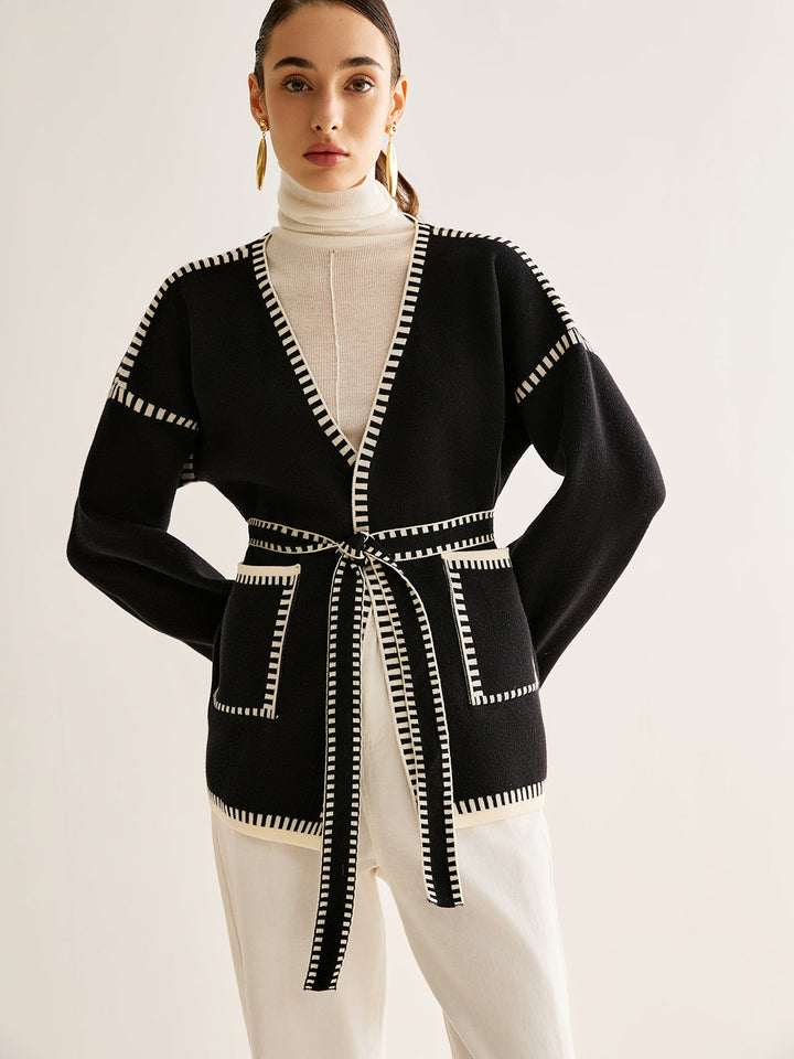 Modern women's tied belt cardigan. Warm, long sleeve knit sweater for everyday casual wear in fall and winter.