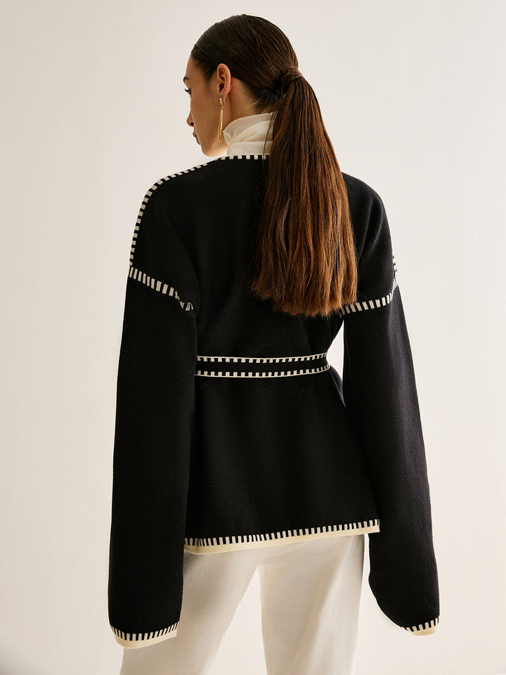Chic women's soft knit cardigan with tied belt. Long sleeve sweater for elegant layering and winter fashion.