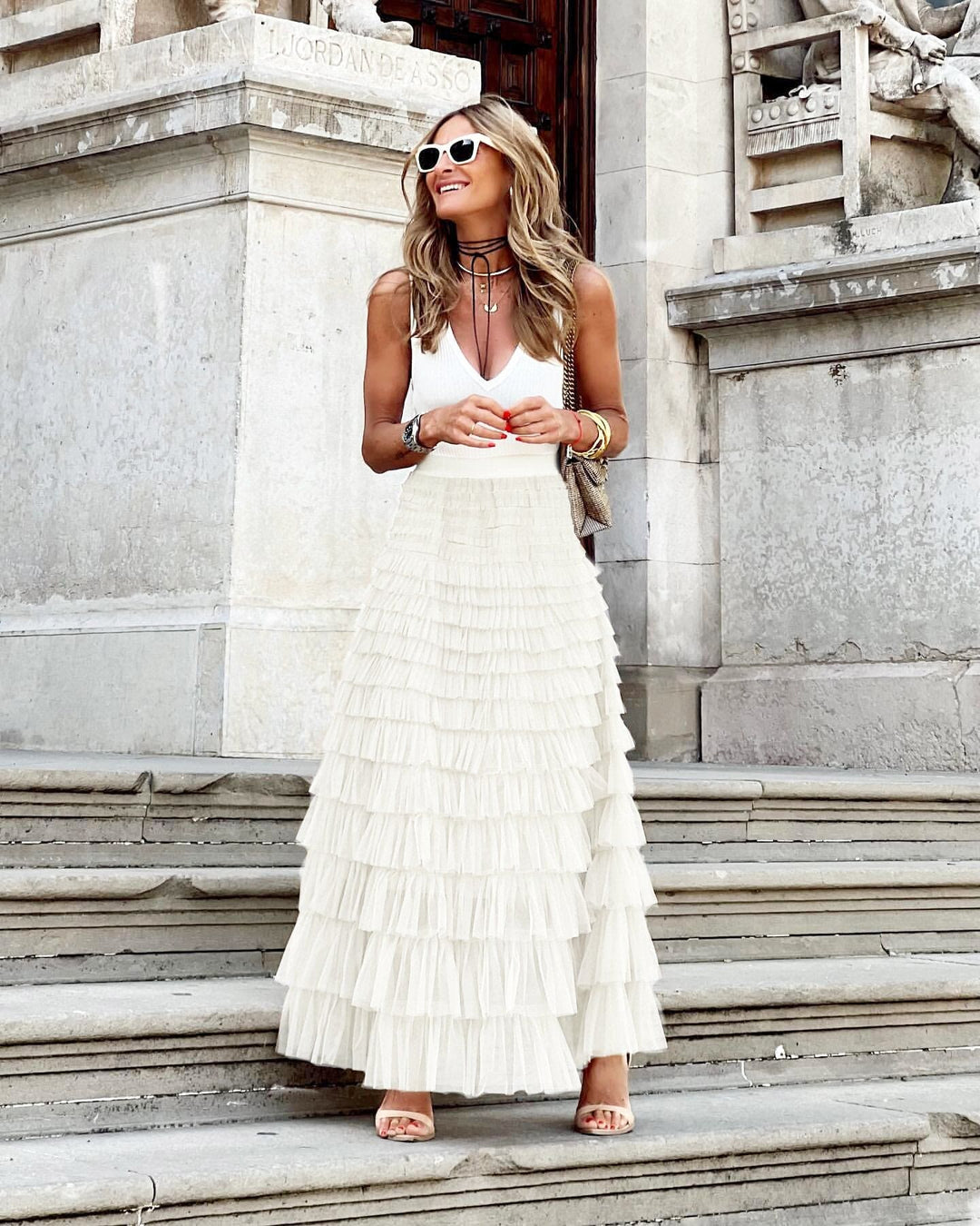Formal women's evening maxi skirt featuring graceful tiers & ruffles, offering an elegant, sophisticated look.